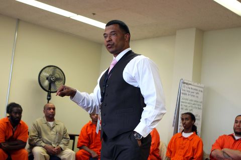 A pastor leads a discussion with prison inmates